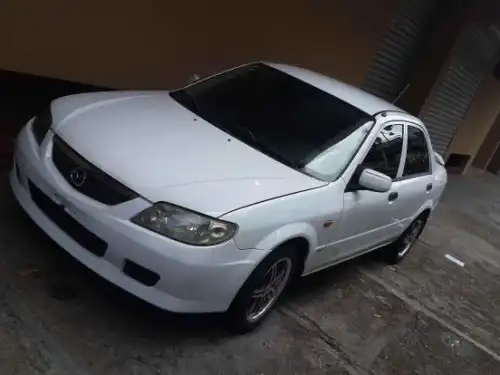 Mazda 323, 2002 version Americana, aros, aire 