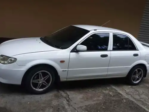 Mazda 323, 2002 version Americana, aros, aire 