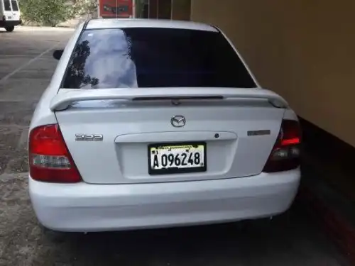 Mazda 323, 2002 version Americana, aros, aire 