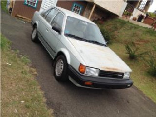 Mazda 323 ,87 ,aut ,1,200